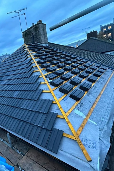 New roof having tiles installed in Stevenage